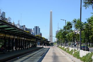 06 Buses Travel Along Avenida 9 de Julio Avenue With The Obelisk Obelisco Beyond Buenos Aires.jpg
